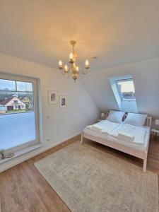 Giường trong phòng chung tại Emils Heidehaus