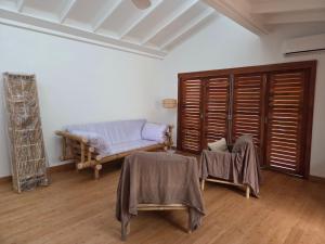 En eller flere senge i et værelse på Kaz Bambou