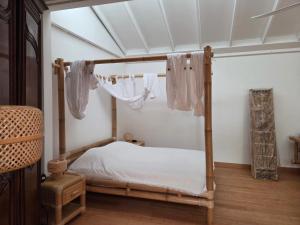 En eller flere senge i et værelse på Kaz Bambou