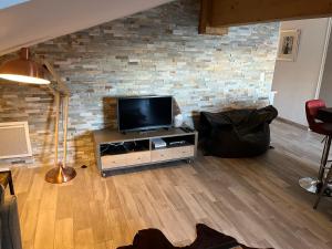 Телевизор и/или развлекательный центр в Les 4 Elements +16 фотографий