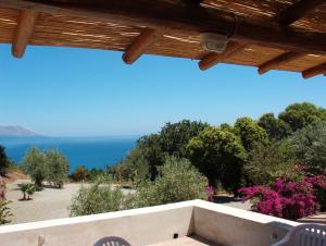 a view of the ocean from the porch of a house at Casa PAGLIERA in Porto San Giorgio