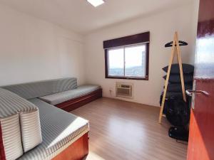 Ένα ή περισσότερα κρεβάτια σε δωμάτιο στο Cobertura duplex c/ terraço e churrasqueira em BC