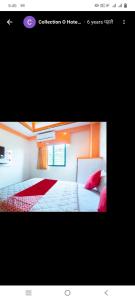 a picture of a bedroom with a bed and avertisement at Hotel paladise in Ahmedabad