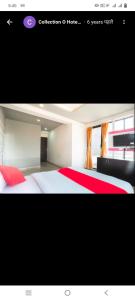 a picture of a bedroom with a bed with red sheets at Hotel paladise in Ahmedabad +2 photos