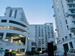 a view of two tall buildings in a city at Hotel Four Season - Gomtinagar - Lucknow in Lucknow