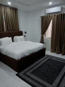 Ένα ή περισσότερα κρεβάτια σε δωμάτιο στο Signature Apartments