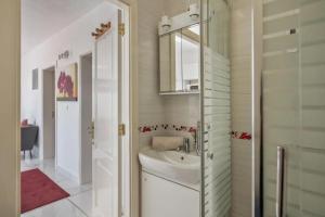 a bathroom with a sink and a shower at Rosa eden in La Asomada +36 photos