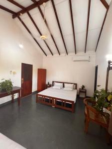 Ένα ή περισσότερα κρεβάτια σε δωμάτιο στο Samaya Waters Bentota