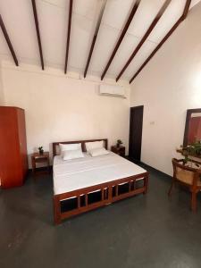 Ένα ή περισσότερα κρεβάτια σε δωμάτιο στο Samaya Waters Bentota