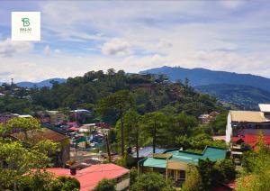 a view of a city with mountains in the background at Balai Berde Baguio in Baguio