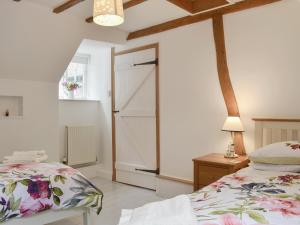 Ένα ή περισσότερα κρεβάτια σε δωμάτιο στο Holme Cottage