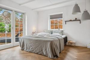 Postel nebo postele na pokoji v ubytování Beach Access Holiday Home in Hornbaek