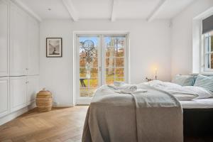 Postel nebo postele na pokoji v ubytování Beach Access Holiday Home in Hornbaek