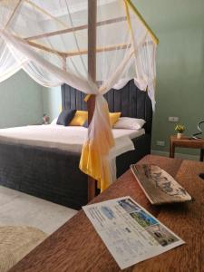 Giường trong phòng chung tại GHhome Zanzibar
