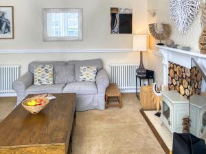 a living room with a couch and a table at Bora House in Newquay +27 photos