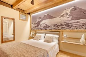 Ένα ή περισσότερα κρεβάτια σε δωμάτιο στο Godioz Suites - Aosta Valley