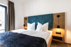 Postel nebo postele na pokoji v ubytování Ferienwohnungen Assenmacher mit Sauna