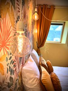 Postel nebo postele na pokoji v ubytování la bonbonnière Jaune