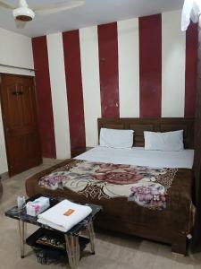 Кровать или кровати в номере Family Inn Guest House +2 фотографии