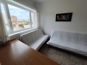 En eller flere senge i et værelse på Casa La Playa con terraza a pie de la Playa