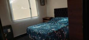 Giường trong phòng chung tại La Iluminada