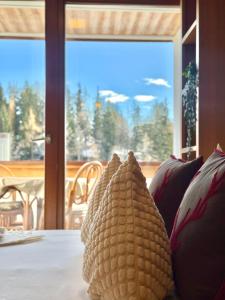 a room with a couch with a view of a window at Lac & Love - Alpine Escape in Crans-Montana