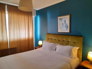 Ένα ή περισσότερα κρεβάτια σε δωμάτιο στο Hôtel Albion