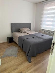 Postel nebo postele na pokoji v ubytování 3C Apartament GRAVENSTEEN