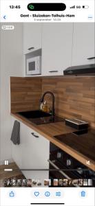 Kuchyň nebo kuchyňský kout v ubytování 3C Apartament GRAVENSTEEN