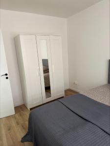 Postel nebo postele na pokoji v ubytování 3C Apartament GRAVENSTEEN