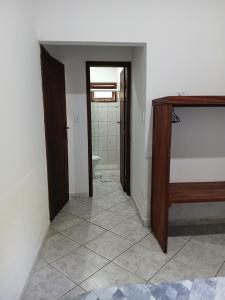 En eller flere senge i et værelse på Entre Árvores Hoosts Confort