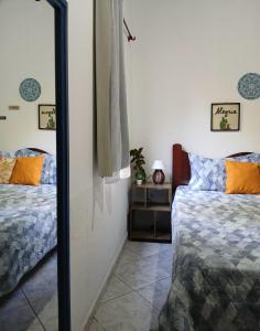 En eller flere senge i et værelse på Entre Árvores Hoosts Confort