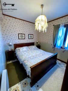 Ένα ή περισσότερα κρεβάτια σε δωμάτιο στο Dimora Del Fabbro