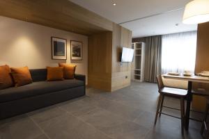 Et opholdsområde på Dolomiten Apartments