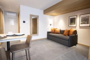 Et opholdsområde på Dolomiten Apartments