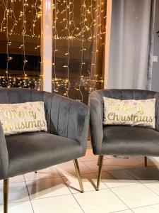 a living room with a couch and christmas lights at RHODESIA guest house in Chalkida