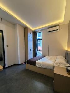 Postel nebo postele na pokoji v ubytování 游子酒店