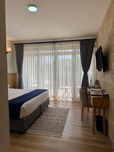 Postel nebo postele na pokoji v ubytování Idan Barn Suites And Café + 54 fotografií