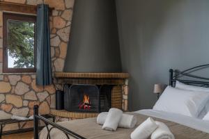 Postel nebo postele na pokoji v ubytování Ξενώνας Θεαλίς