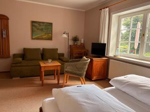 TV a/nebo společenská místnost v ubytování Landhaus Morgensünn