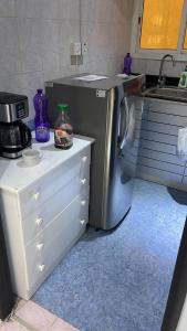 Kuchyň nebo kuchyňský kout v ubytování KhavaQatar Hostel 1 بيت مشترك