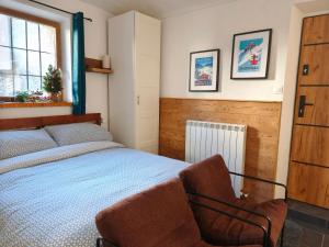 Ένα ή περισσότερα κρεβάτια σε δωμάτιο στο Hideaway Apartments - Ski Sauze d'Oulx and the Via Lattea