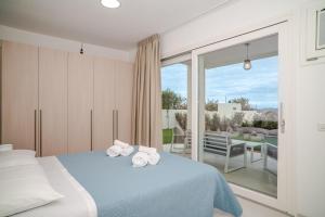 Postel nebo postele na pokoji v ubytování Acquamarina Apartment + 18 fotografií