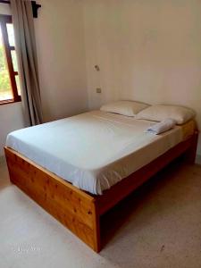 En eller flere senge i et værelse på Pearl Stays