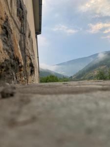a view from the side of a building with mountains in the background at FoRest Apartment in Mokra Gora