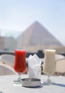 a table with three different types of candles on it at Middle east panorama jacuzzi & spa in Cairo