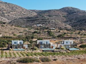 a house in the middle of a mountain at Elysian Villas Ios in Ios Chora