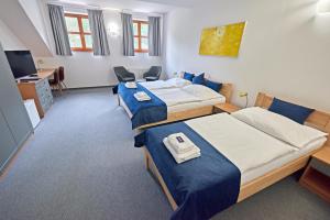 Postel nebo postele na pokoji v ubytování Benedikt Most