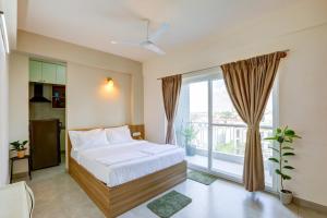 Postel nebo postele na pokoji v ubytování Acasa Suites - ITPL Whitefield, Near Manipal Hospital
