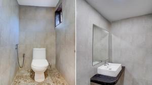 een badkamer met toilet en wastafel bij Hotel Beachfront - Couple & Family Friendly in Calangute